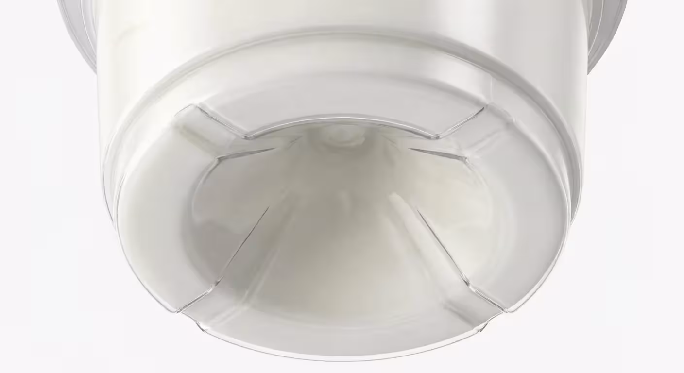A close-up view of the deep indentation at the bottom of a plastic food container.