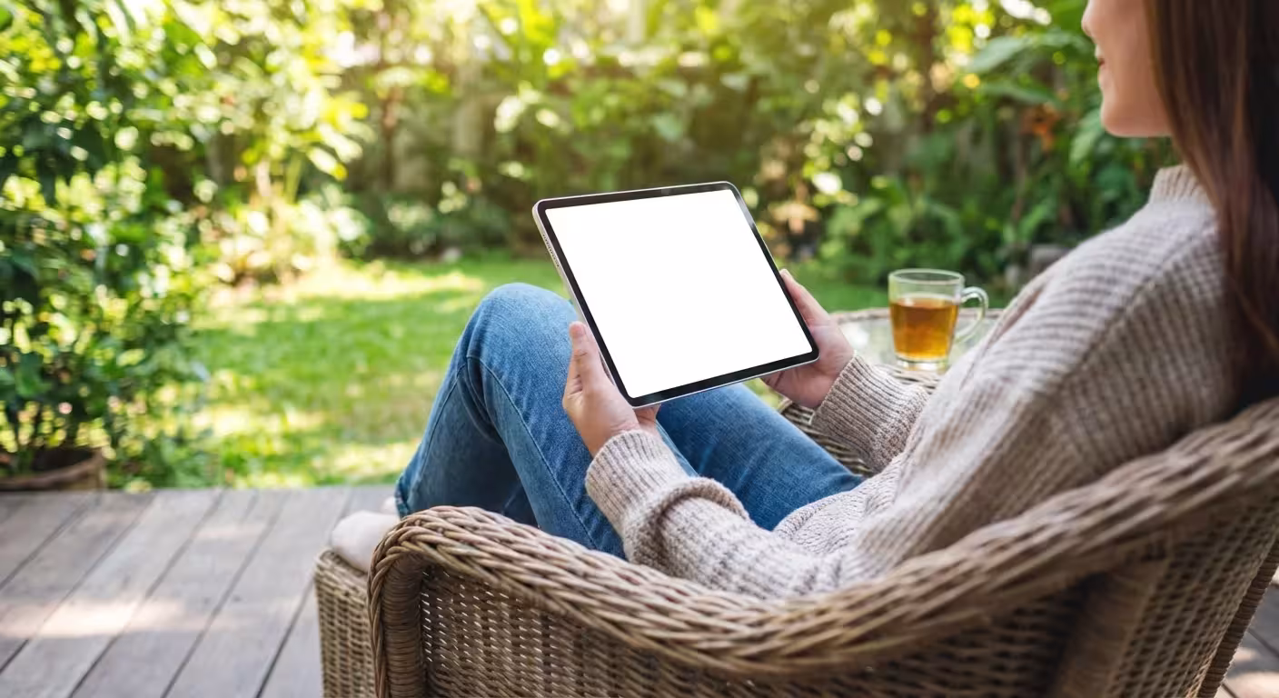 A person peacefully using a tablet outdoors, representing a spam-free shopping experience.